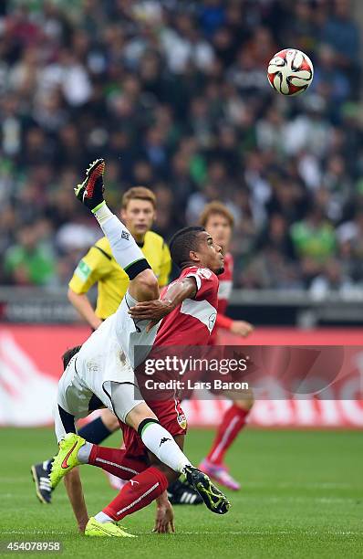 Granit Xhaka of Moenchengladbach falls over Daniel Davari of Stuttgart during the Bundesliga match between Borussia Moenchengladbach and VfB...