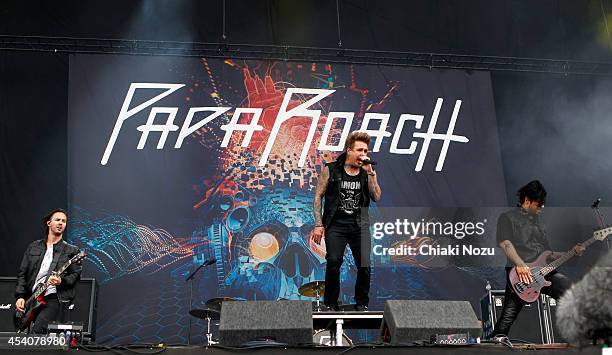 Jerry Horton, Jacoby Shaddix and Tobin Esperance of Papa Roach perform on Day 3 of the Reading Festival at Richfield Avenue on August 24, 2014 in...