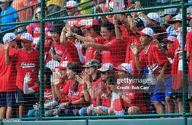 Fans of Team Japan cheer on their team after defeating the West Team from Las Vegas, Nevada during the Little League World Series third place game at...