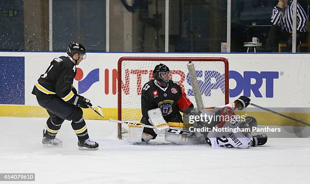 Chris Abbott of Lulea collides with goal tender Craig Kowalski of Nottingham Panthers during the Champions Hockey League group stage game between...