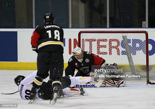 Goal tender Martins Raitums of Nottingham Panthers save a shot on goal by Lars Bryggman of Lulea during the Champions Hockey League group stage game...