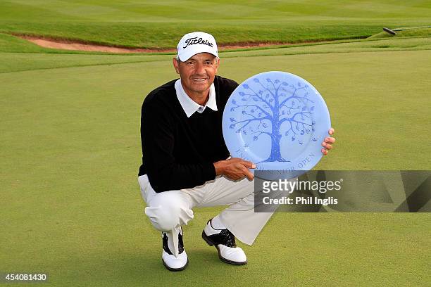 Cesar Monasterio of Argentina poses with the trophy after the final round of the English Senior Open played at Rockliffe Hall on August 24, 2014 in...
