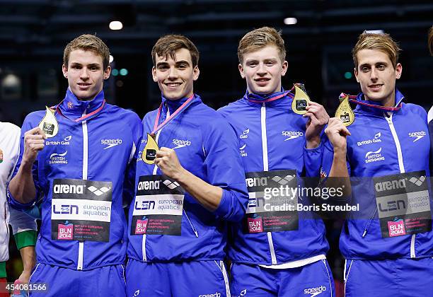 The team of Great Britain celebrates after winning the gold medal in the men's 4x100m medley final during day 12 of the 32nd LEN European Swimming...