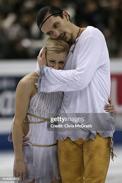 Tatiana Volosozhar and Maxim Trankov of Russia embrace after their routine in the Pairs Free Skating Final during day three of the ISU Grand Prix of...