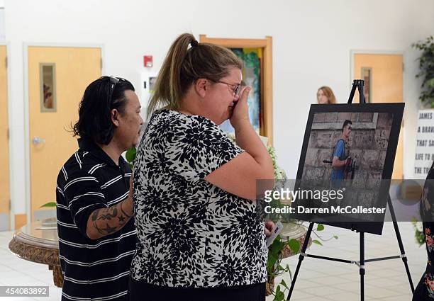 People enter Our Lady of the Rosary Church for a special mass in remembrance of journalist James Foley August 24, 2014 in Rochester, New Hampshire....