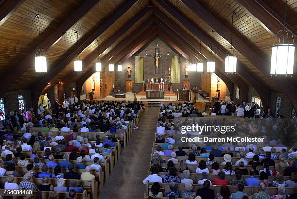 People attend a special mass in remembrance of journalist James Foley at Our Lady of the Rosary Church for August 24, 2014 in Rochester, New...