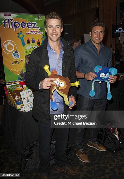 Robert Graham and Zack Kalter attend the Jingle Ball Backstage Gifting Suite sponsored by Flips Audio at Staples Center on December 6, 2013 in Los...