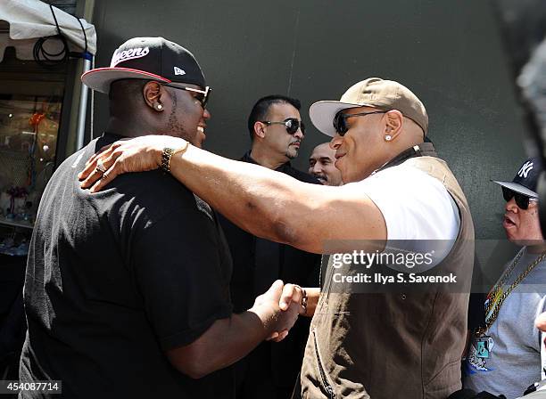 WorldStar Hip Hop CEO Lee O'Denat and LL Cool J attend the 2nd Annual Worldstar Foundation Back To School Giveaway at Jamaica Colosseum Mall on...