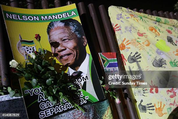 People gathering in Vilakazi street on December 6 in Johannesburg, South Africa. The Father of the Nation, Nelson Mandela, Tata Madiba, passed away...