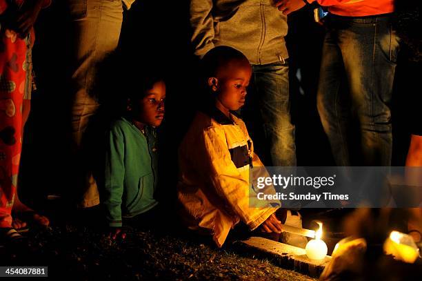 People gathering in Vilakazi street on December 6 in Johannesburg, South Africa. The Father of the Nation, Nelson Mandela, Tata Madiba, passed away...