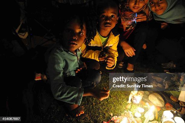 People gathering in Vilakazi street on December 6 in Johannesburg, South Africa. The Father of the Nation, Nelson Mandela, Tata Madiba, passed away...