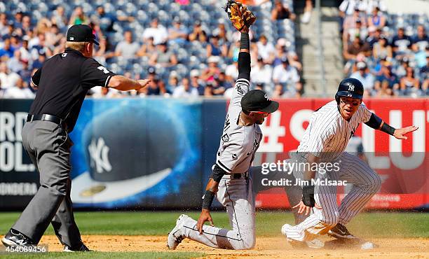 Jacoby Ellsbury of the New York Yankees steals second base in the ninth inning ahead of the tag from Alexei Ramirez of the Chicago White Sox as...