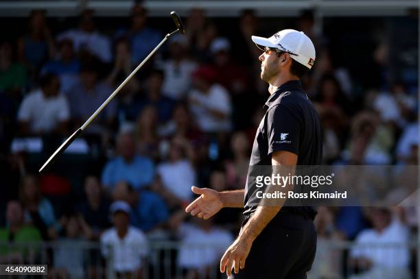 Cameron Tringale reacts after missing a putt on the 18th green during the final round of The Barclays at The Ridgewood Country Club on August 24,...