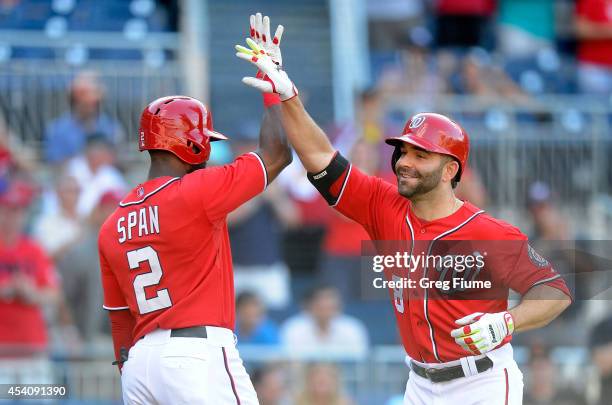 Danny Espinosa of the Washington Nationals celebrates with Denard Span after hitting a home run in the eighth inning against the San Francisco Giants...