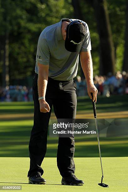 Hunter Mahan reacts as he finishes on the 18th green during the final round of The Barclays at The Ridgewood Country Club on August 24, 2014 in...