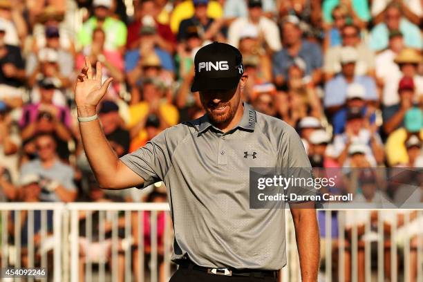 Hunter Mahan reacts as he finishes on the 18th green during the final round of The Barclays at The Ridgewood Country Club on August 24, 2014 in...