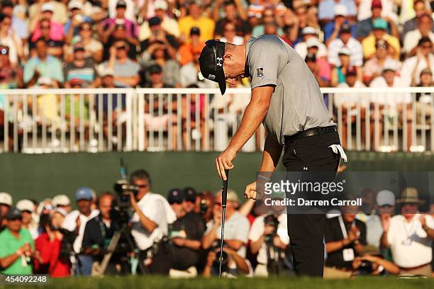 Hunter Mahan reacts as he finishes on the 18th green during the final round of The Barclays at The Ridgewood Country Club on August 24, 2014 in...
