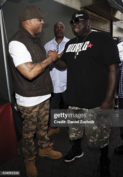 Cool J and WorldStarHipHop CEO Lee O'Denat attend the 2nd Annual Worldstar Foundation Back To School Giveaway at Jamaica Colosseum Mall on August 24,...