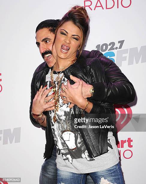 Reza Farahan and Golnesa 'GG' Gharachedaghi attend KIIS FM's Jingle Ball at Staples Center on December 6, 2013 in Los Angeles, California.