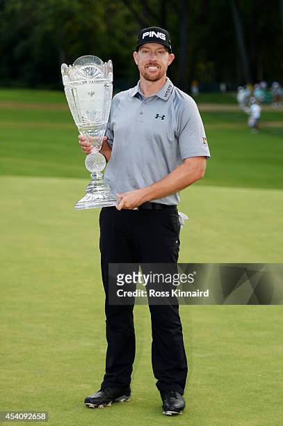 Hunter Mahan celebrates with the tournament trophy after winning of The Barclays at The Ridgewood Country Club on August 24, 2014 in Paramus, New...