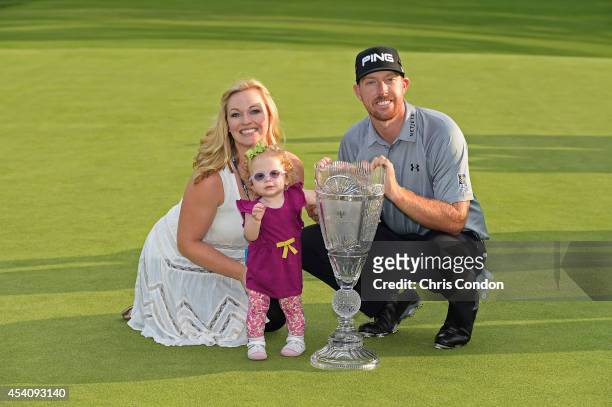 Hunter Mahan poses with his wife Kandi, daughter Zoe and the tournament trophy after winn ing The Barclays at Ridgewood Country Club on August 24,...