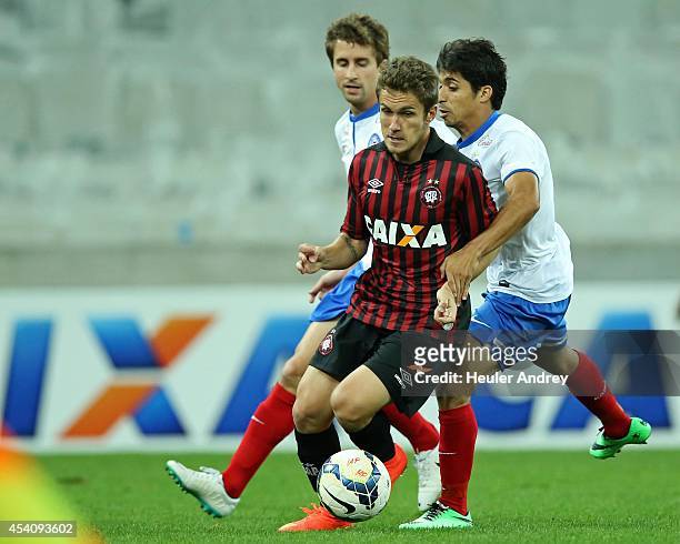 Bady of Atletico-PR competes for the ball with Roniery and Fahel of Bahia during the match between Atletico-PR and Bahia for the Brazilian Series A...