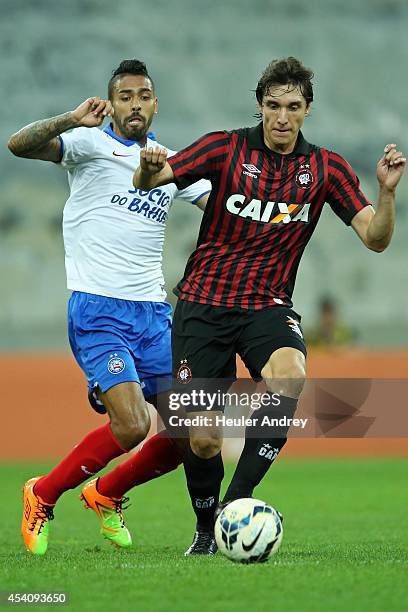 Cleo of Atletico-PR competes for the ball with Demerson of Bahia during the match between Atletico-PR and Bahia for the Brazilian Series A 2014 at...