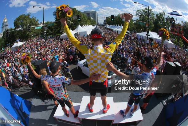 General classification winner Tejay van Garderen of the United States riding for the BMC Racing Team celebrates on the podium with second place...