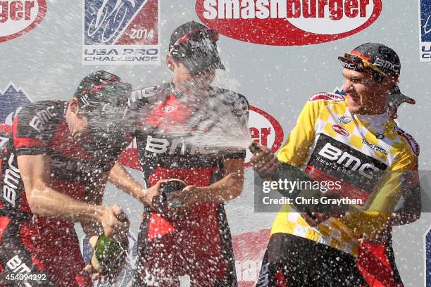 Tejay van Garderen of the United States riding for the BMC Racing Team celebrates in the yellow leader's jersey celebrates with his team on the...