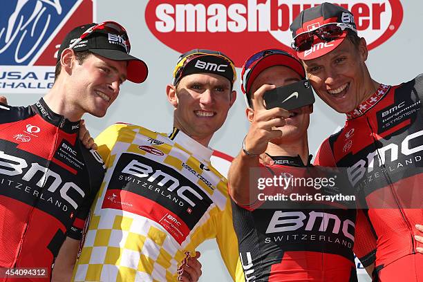 Tejay van Garderen of the United States riding for the BMC Racing Team celebrates in the yellow leader's jersey with his team on the podium after the...