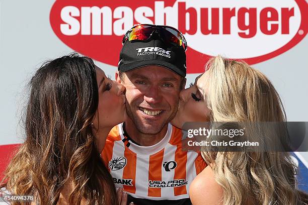 Jens Voigt of Germany riding for Trek Factory Racing celebrates on the podium in the orange most courageous rider jersey after the final stage of the...