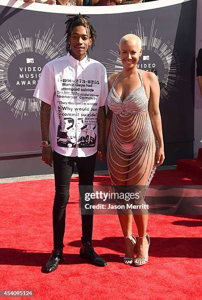 Rapper Wiz Khalifa and model Amber Rose attend the 2014 MTV Video Music Awards at The Forum on August 24, 2014 in Inglewood, California.