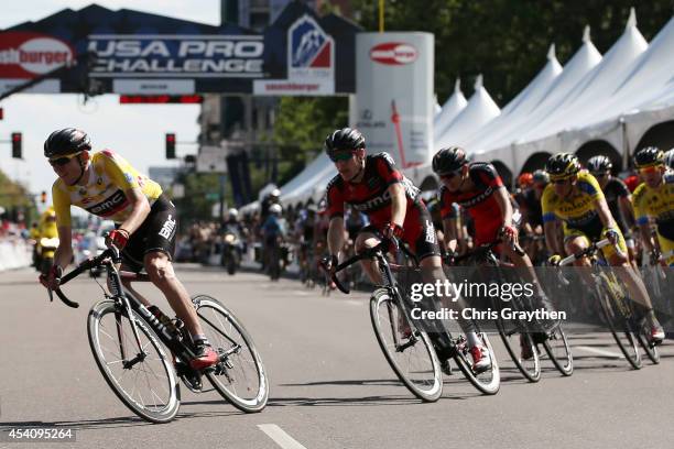 Tejay van Garderen of the United States riding for the BMC Racing Team in the yellow leader's jersey rides in the peloton during the final stage of...