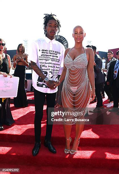 Rapper Wiz Khalifa and model Amber Rose attend the 2014 MTV Video Music Awards at The Forum on August 24, 2014 in Inglewood, California.
