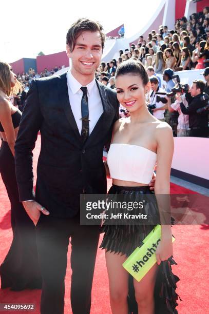 Actress Victoria Justice and Pierson Fode attend the 2014 MTV Video Music Awards at The Forum on August 24, 2014 in Inglewood, California.
