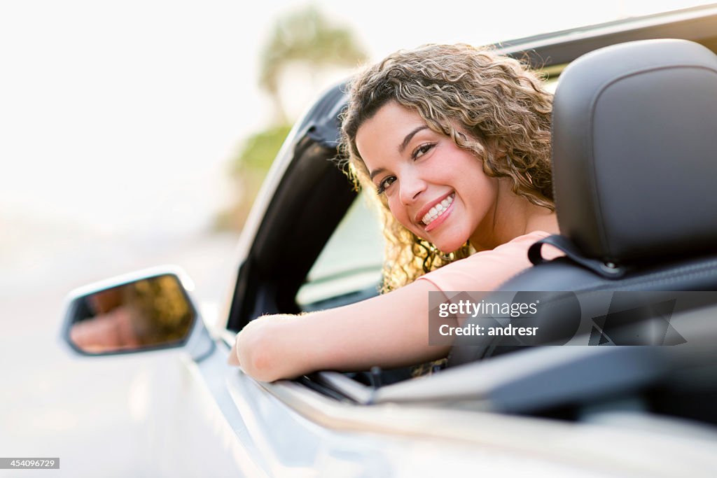 Woman driving her new car
