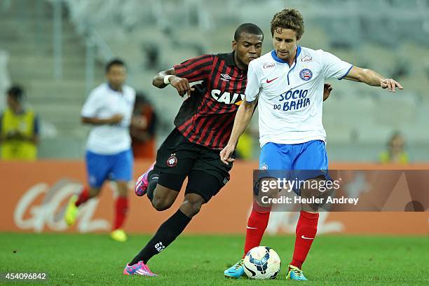 Marcelo of Atletico-PR competes for the ball with Fahel of Bahia during the match between Atletico-PR and Bahia for the Brazilian Series A 2014 at...