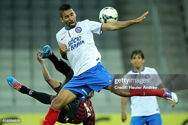 Douglas Coutinho of Atletico-PR competes for the ball with Demerson of Bahia during the match between Atletico-PR and Bahia for the Brazilian Series...