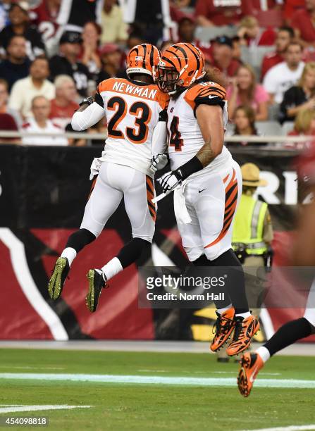 Cornerback Terence Newman and defensive tackle Domata Peko of the Cincinnati Bengals celebrate a touchdown during the first quarter of an NFL...