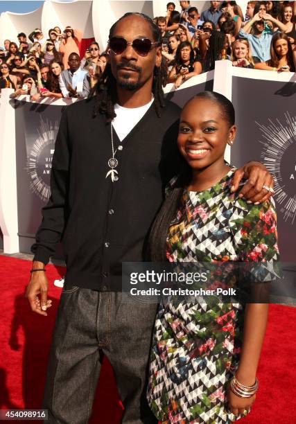 Recording artist Snoop Dogg and Cori Broadus attend the 2014 MTV Video Music Awards at The Forum on August 24, 2014 in Inglewood, California.
