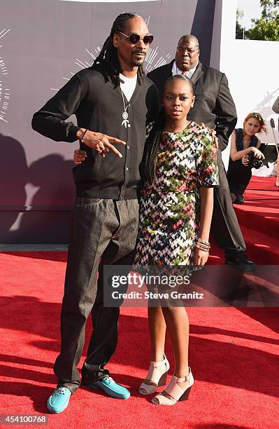 Recording artist Snoop Dogg and Cori Broadus attend the 2014 MTV Video Music Awards at The Forum on August 24, 2014 in Inglewood, California.