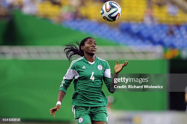 Asisat Oshoala of Nigeria watches the ball descend during the FIFA Women's U-20 Final against Germany at Olympic Stadium on August 24, 2014 in...