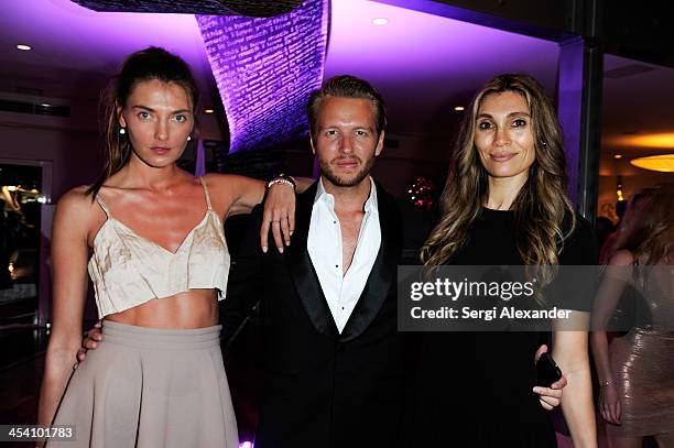 Aliba Baikova, Michael Lillelund and Christina Sands attend Niche Media Party Hosted By Zoe Saldana on December 6, 2013 in Miami Beach, Florida.