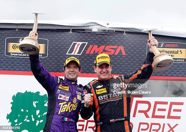 Luis Diaz , L, celebrates with car owner Enzo Potolicchio after winning the IMSA Tudor Series PC race at Virginia International Raceway on August 24,...