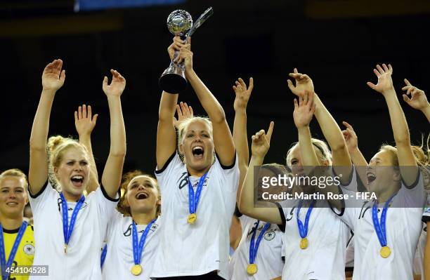 Lena Petermann of Germany lifts the trophy after winning the FIFA U-20 Women's World Cup 2014 final match between Nigeria and Germany at Olympic...