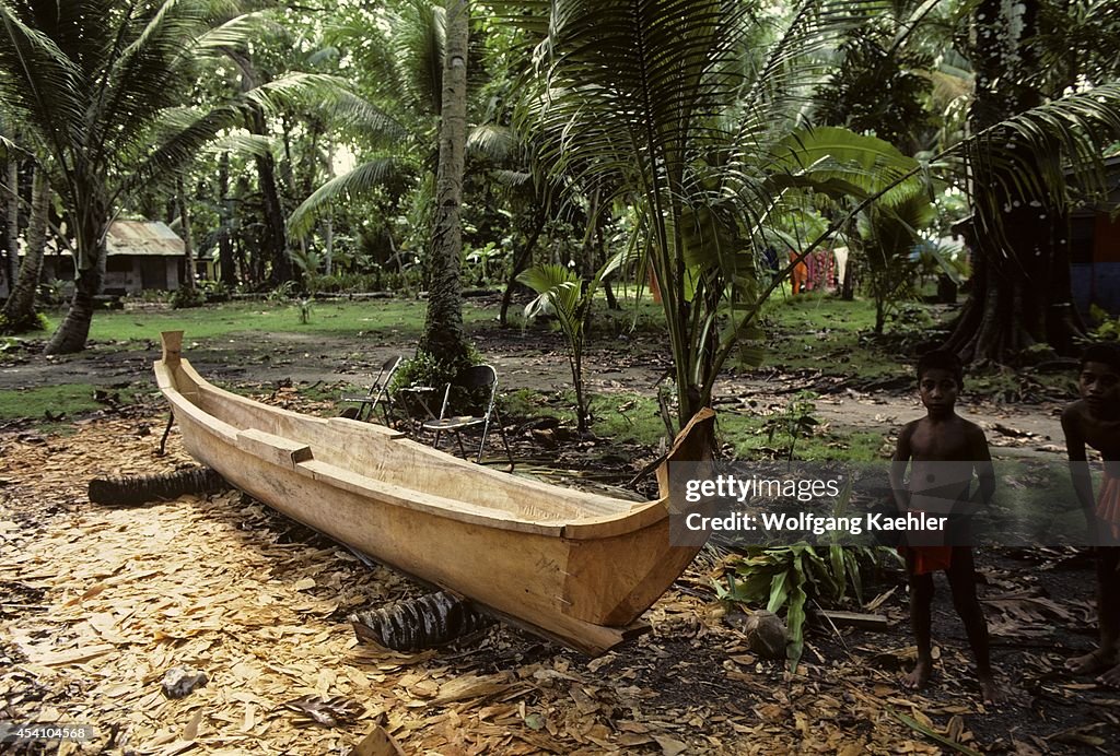 Micronesia, Caroline Isls. Pulap Island, Dugout Canoe Being...