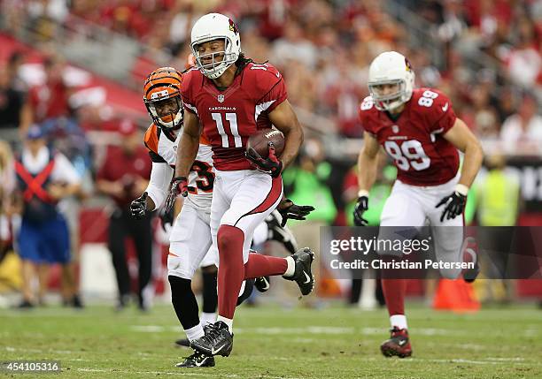 Wide receiver Larry Fitzgerald of the Arizona Cardinals breaks up field during the second quarter of the preseason NFL game against the Cincinnati...