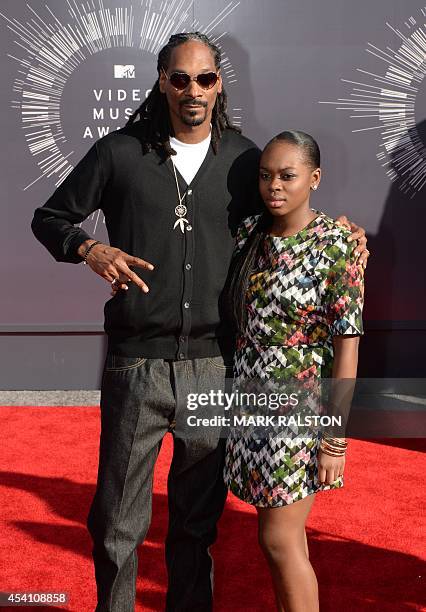 Recording artist Snoop Dogg and Cori Broadus arrive on the red carpet at the MTV Video Music Awards , August 24, 2014 at The Forum in Inglewood,...