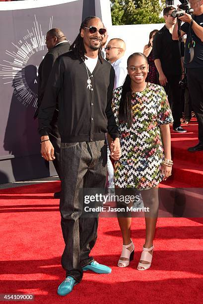 Recording artist Snoop Dogg and Cori Broadus attend the 2014 MTV Video Music Awards at The Forum on August 24, 2014 in Inglewood, California.