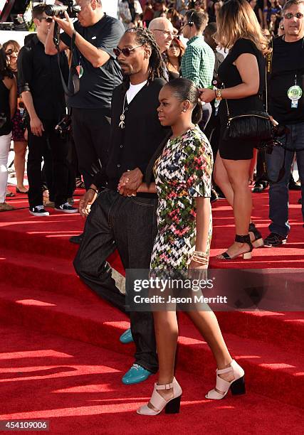 Recording artist Snoop Dogg and Cori Broadus attend the 2014 MTV Video Music Awards at The Forum on August 24, 2014 in Inglewood, California.